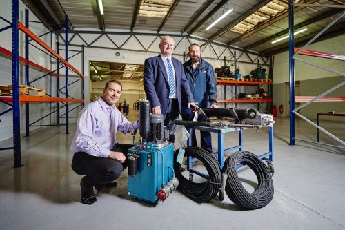 Mark Harnett, from Lloyds Bank Commercial Banking, is flanked by Norton Fluid Power's Peter Andrews and Jon Andrews