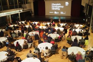 A group screening of the National Emergency Briefing
